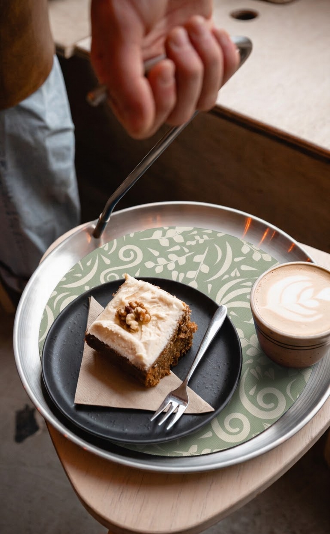 Cake and a latte on the Topple Tray with the sage botanical mat